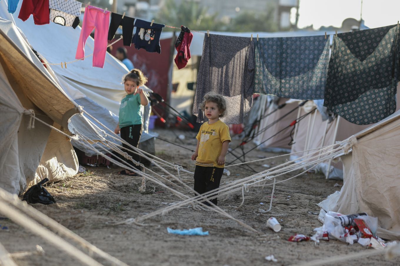 Internally displaced Palestinians find shelter in tents at a camp run by the United Nations Relief and Works Agency (UNRWA) in western Khan Yunis, Gaza, on October 26, 2023. (Photo by Loay Ayyoub/For The Washington Post)